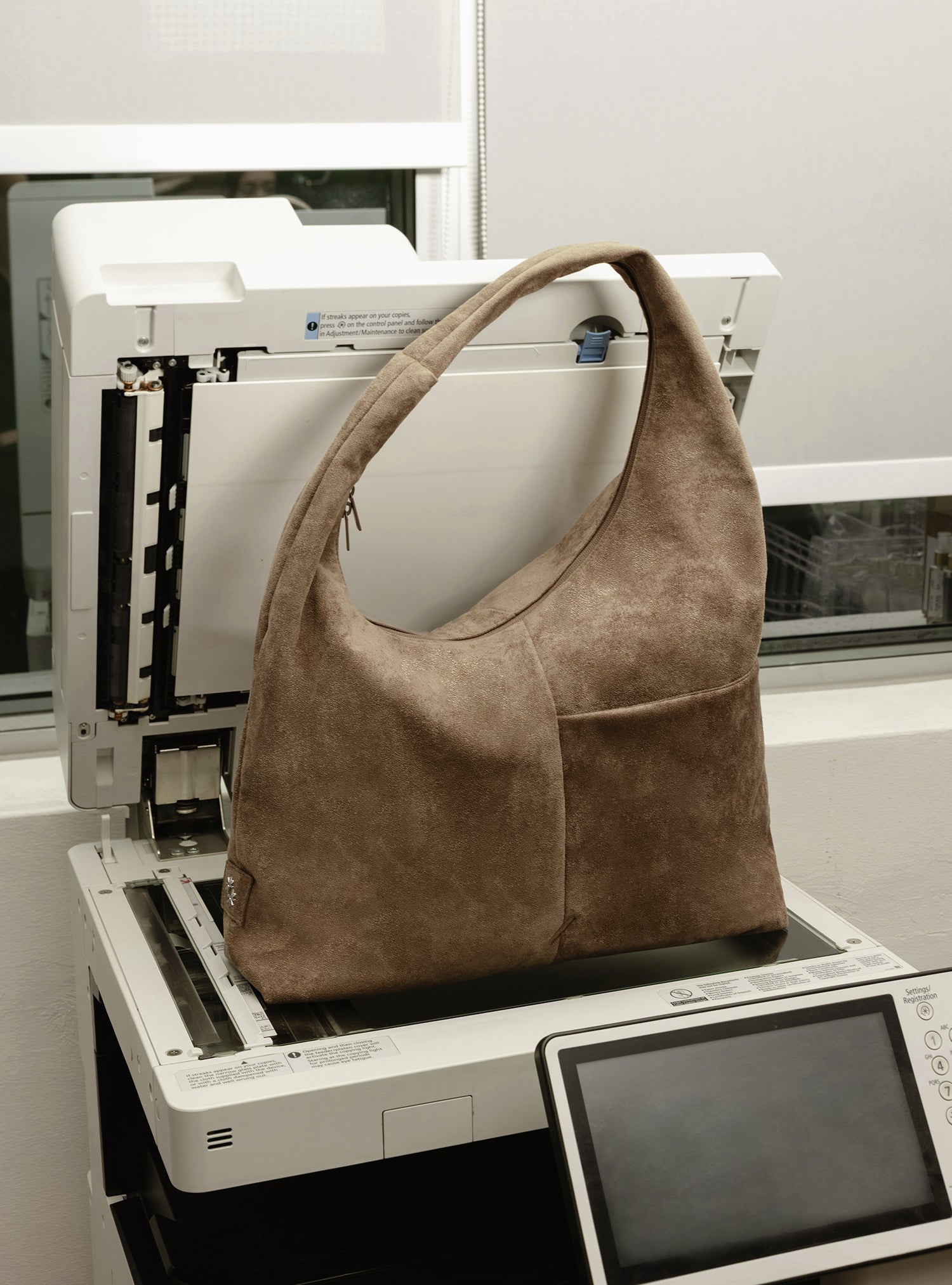 The Arc slouchy hobo-style bag in grey-beige suede for work and office