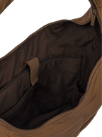 Interior of the Arc hobo-style bag in chocolate brown nylon, with laptop compartment
