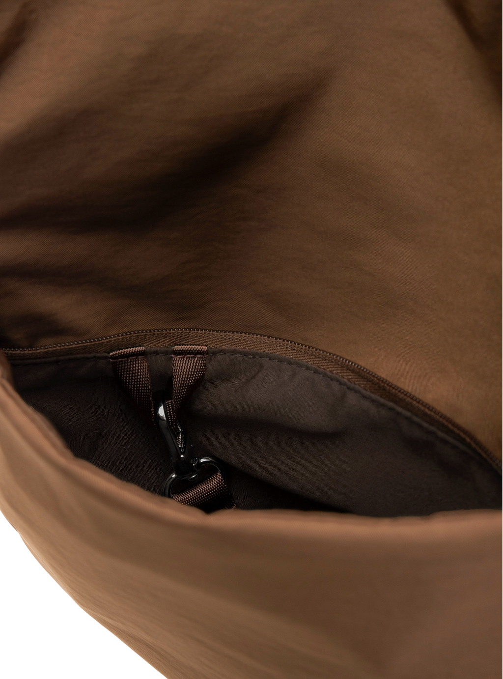 Exterior pocket of the Arc hobo-style bag in chocolate brown nylon with concealed snap loop