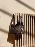 The Midi Arc slouchy hobo bag in dark brown vegan leather for work, travel and everyday use