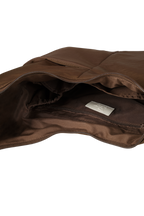 Interior of the Midi Arc hobo-style bag in chocolate brown nylon, with multiple pockets and a bottle holder