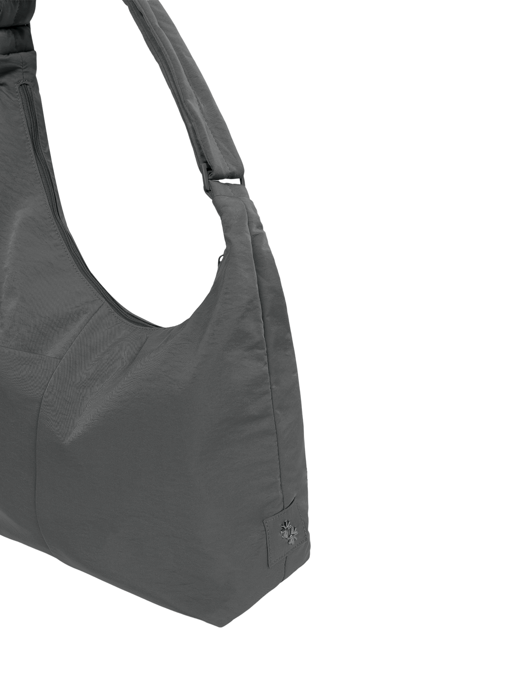 Close-up of the Midi Arc hobo-style bag in dark grey nylon, showing metal logo emblem