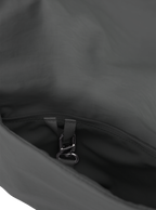 Exterior pocket of the Midi Arc hobo-style bag in dark grey nylon, with concealed snap loop