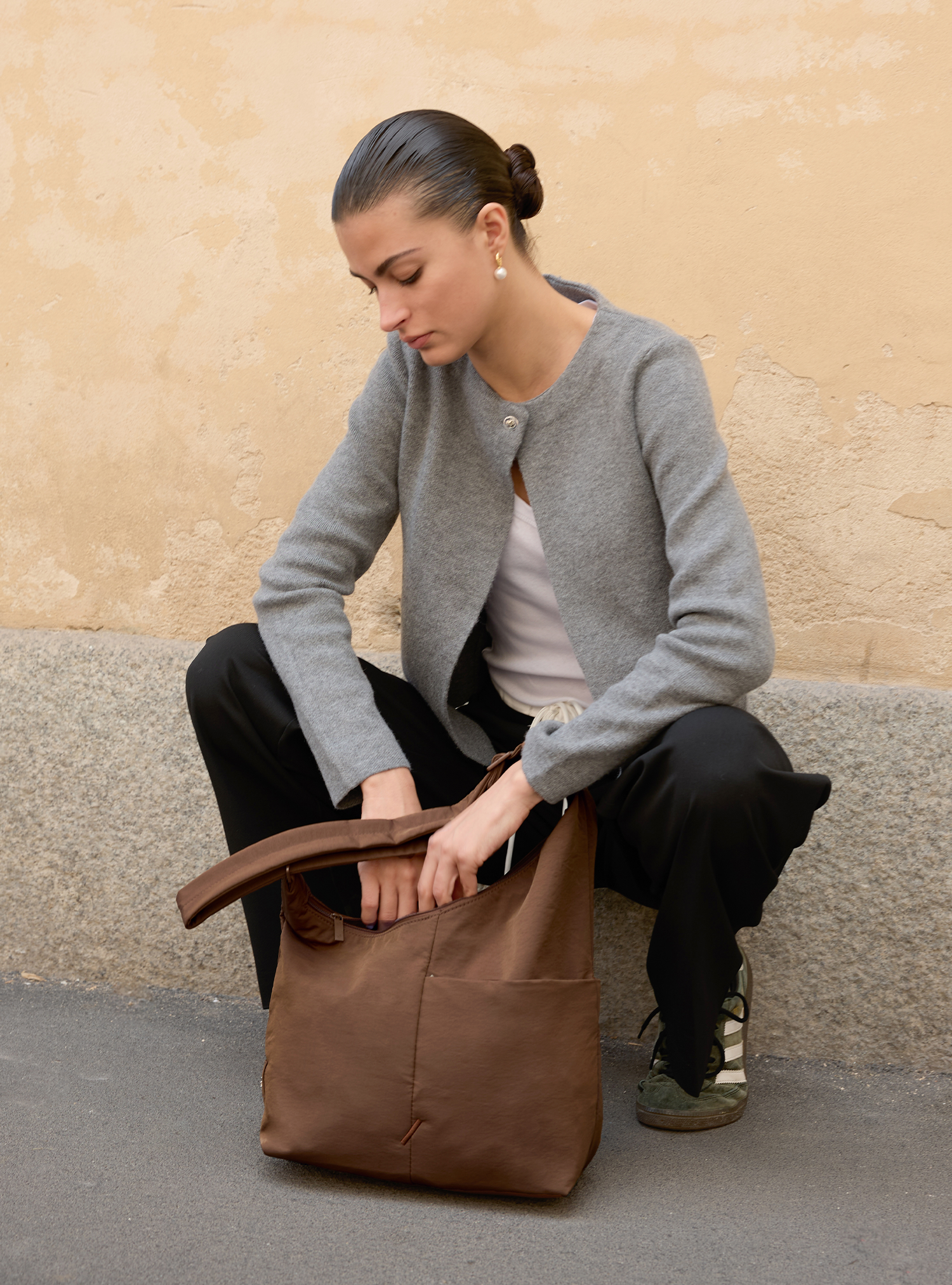 Woman with the Midi Arc slouchy hobo bag in chocolate brown nylon for work, travel and everyday use