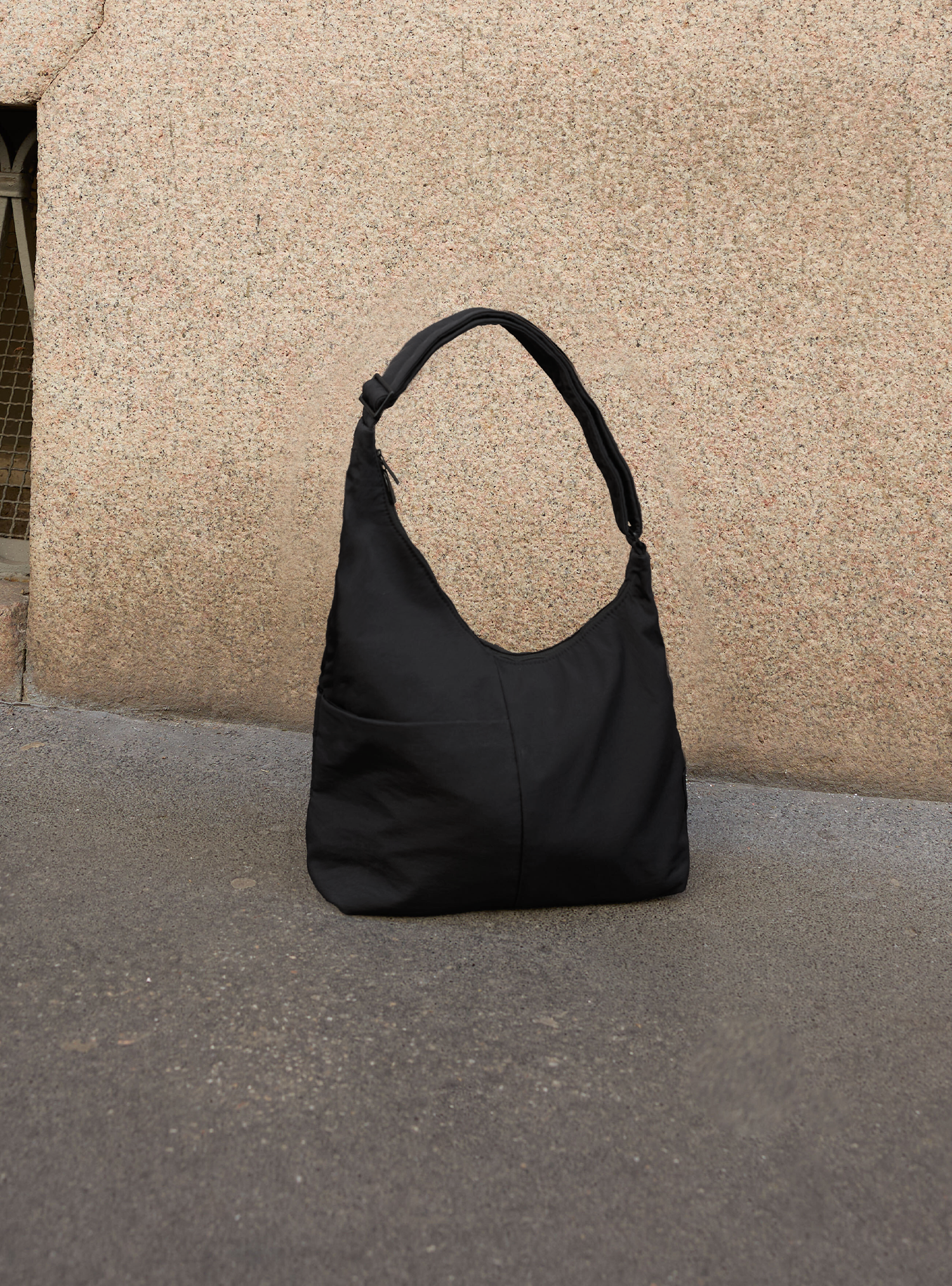 The Midi Arc slouchy hobo bag in black nylon for work, travel and everyday use