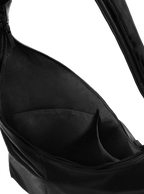 Interior of the Midi Arc hobo-style bag in matte black vegan leather, with multiple pockets