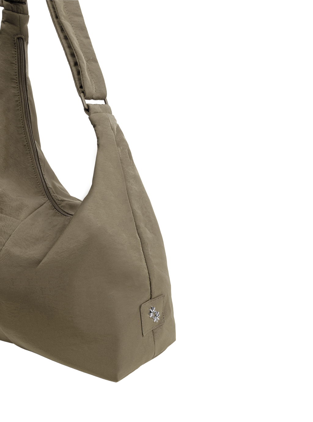 Close-up of the Midi Arc hobo-style bag in beige nylon, showing metal logo emblem