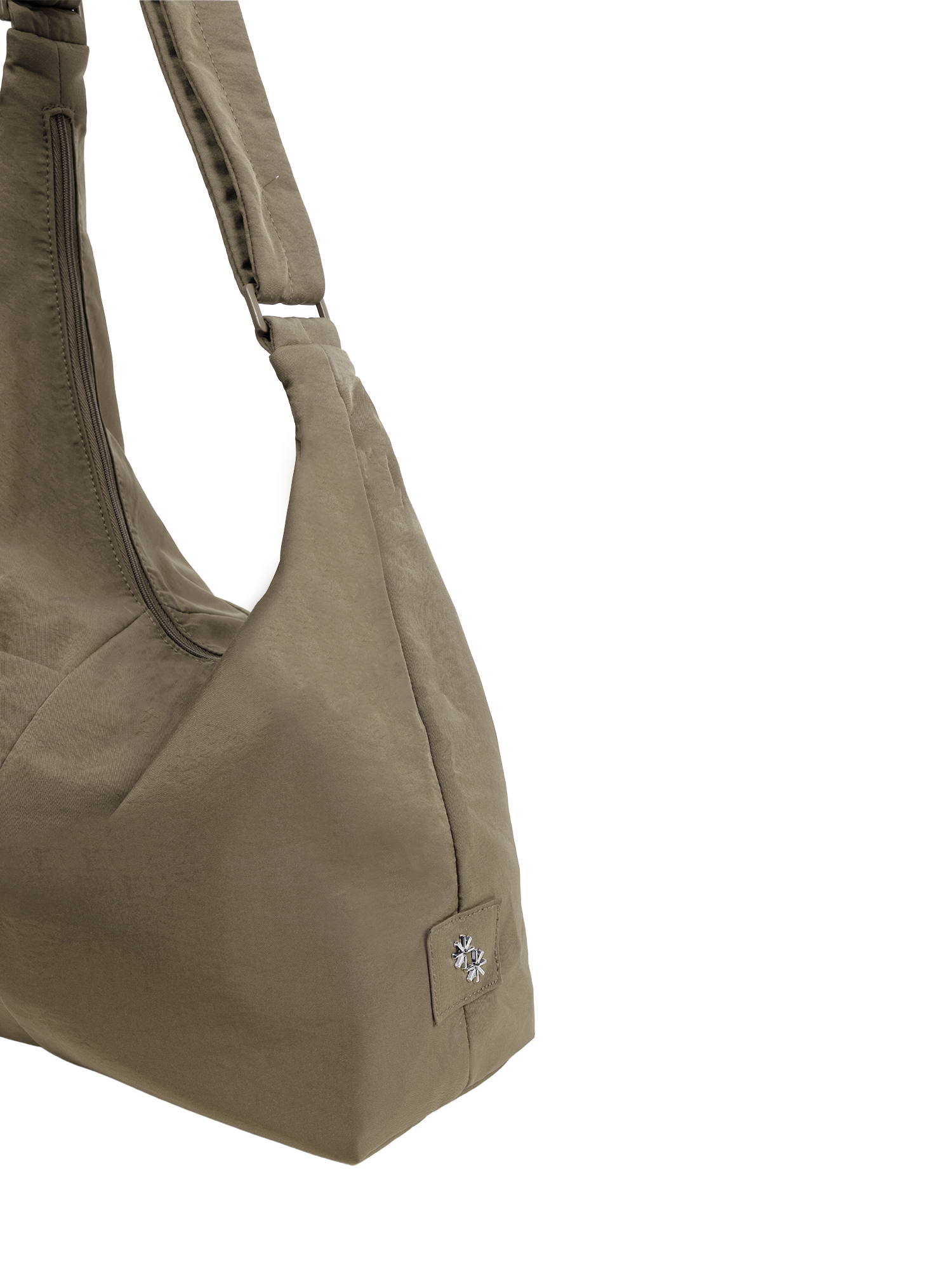 Close-up of the Midi Arc hobo-style bag in beige nylon, showing metal logo emblem