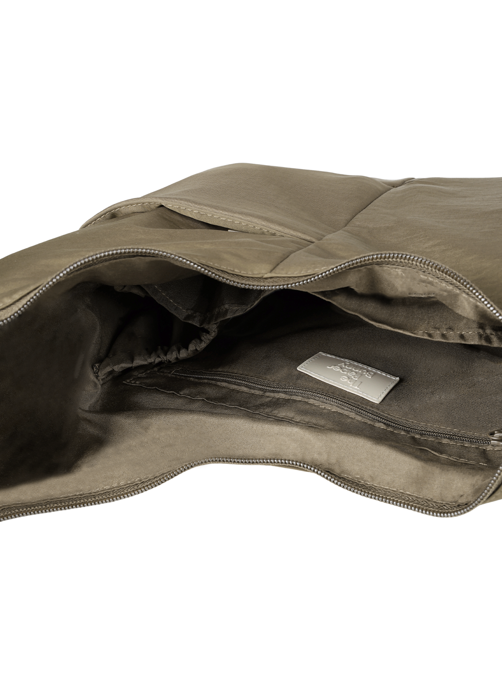 Interior of the Midi Arc hobo-style bag in beige nylon, with multiple pockets and a bottle holder