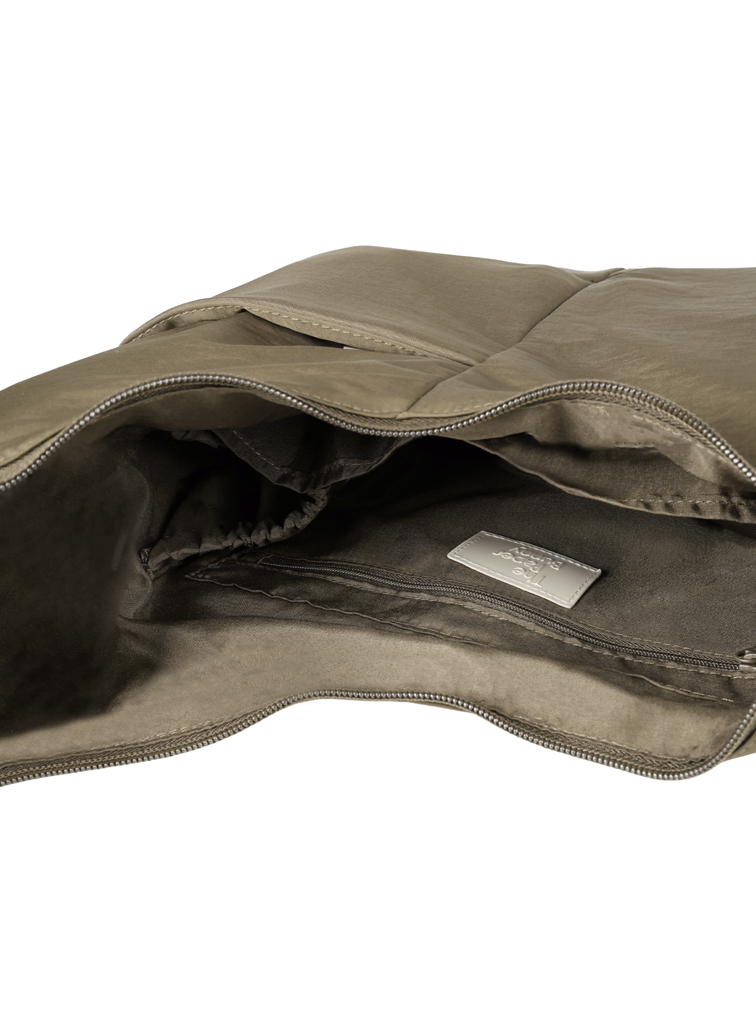 Interior of the Midi Arc hobo-style bag in beige nylon, with multiple pockets and a bottle holder