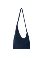 The Midi Arc slouchy hobo bag in navy nylon with adjustable strap for shoulder or crossbody wear
