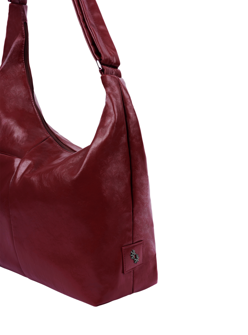 The Midi Arc slouchy hobo-style bag in wine red vegan leather with adjustable shoulder strap