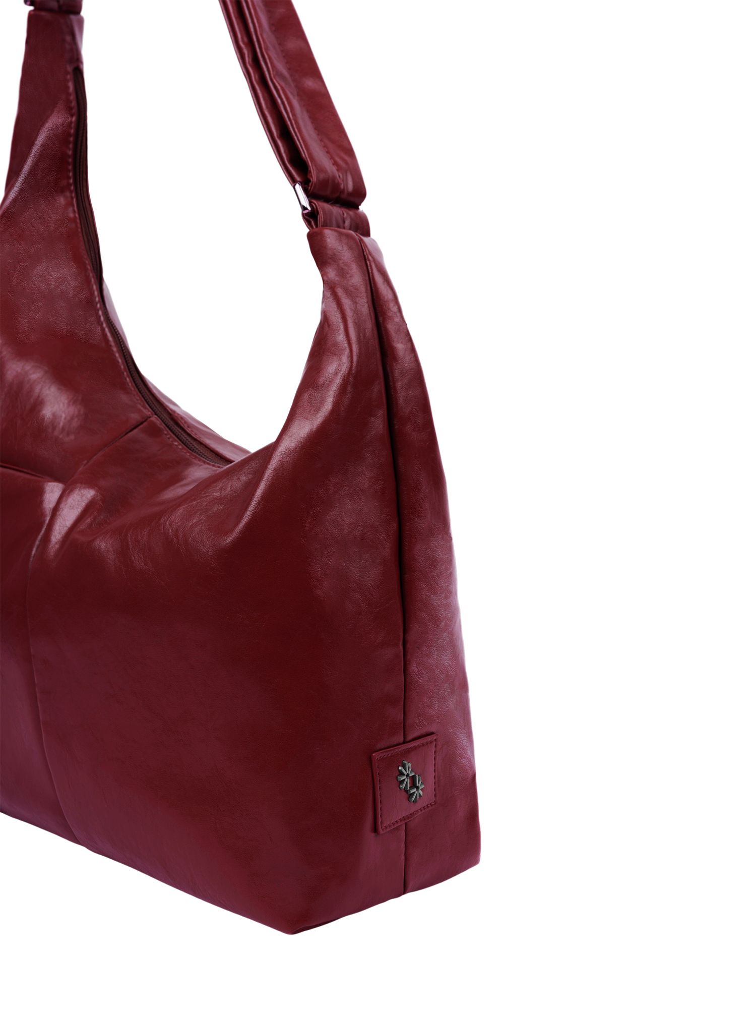The Midi Arc slouchy hobo-style bag in wine red vegan leather with adjustable shoulder strap
