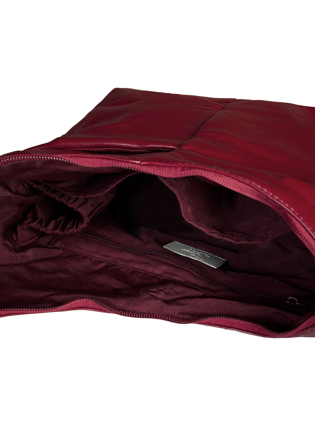 Interior of the Midi Arc hobo-style bag in wine red vegan leather, with multiple pockets and a bottle holder