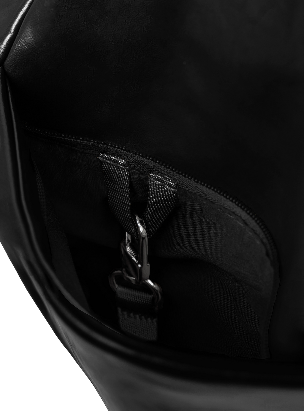 Exterior pocket of the Midi Arc hobo-style bag in black vegan leather, with concealed snap loop