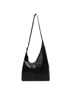 The Midi Arc slouchy hobo bag in black vegan leather with adjustable strap for shoulder or crossbody wear