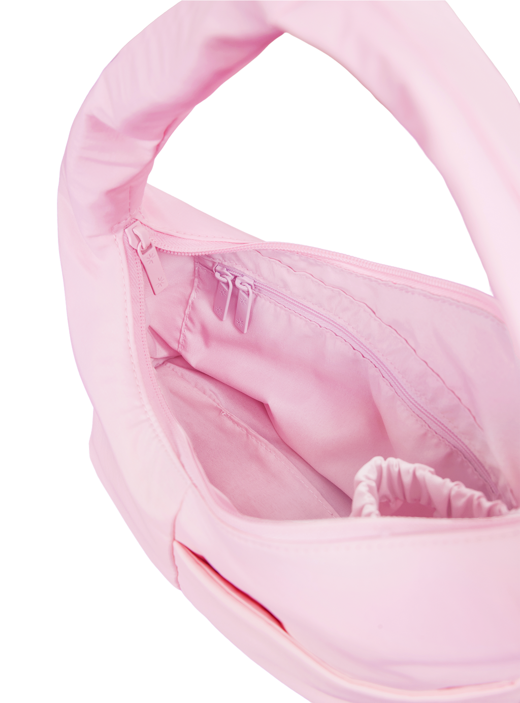 Interior of the Mini Arc hobo-style shoulder bag in light pink nylon, with multiple pockets and a bottle holder