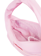 Interior of the Mini Arc hobo-style shoulder bag in light pink nylon, with multiple pockets and a bottle holder