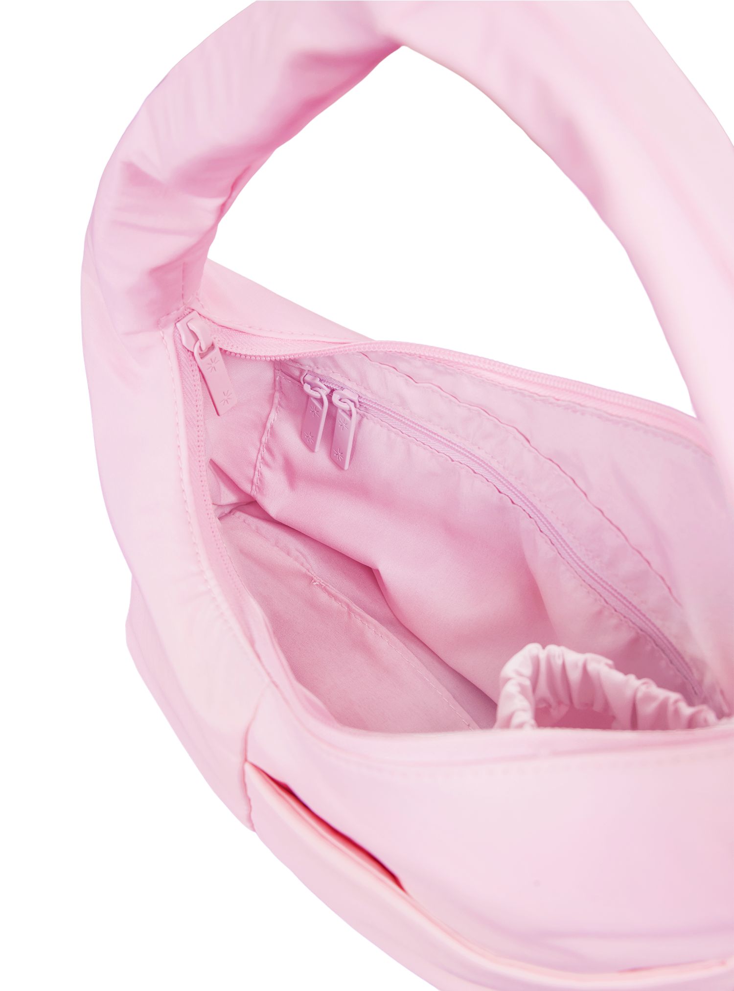 Interior of the Mini Arc hobo-style shoulder bag in light pink nylon, with multiple pockets and a bottle holder