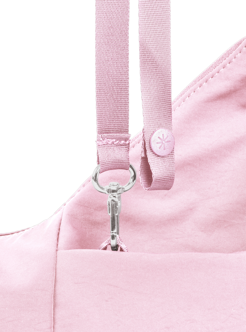 Exterior pocket of the Mini Arc hobo-style shoulder bag in light pink nylon, with concealed snap loop