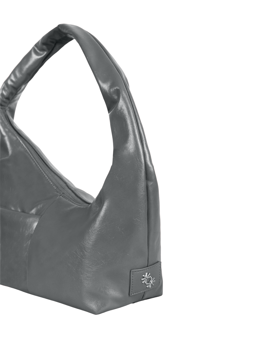 Close-up of the Mini Arc hobo-style shoulder bag in deep grey vegan leather, showing metal logo emblem