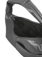Interior of the Mini Arc hobo-style shoulder bag in deep grey vegan leather, with zipped interior pocket