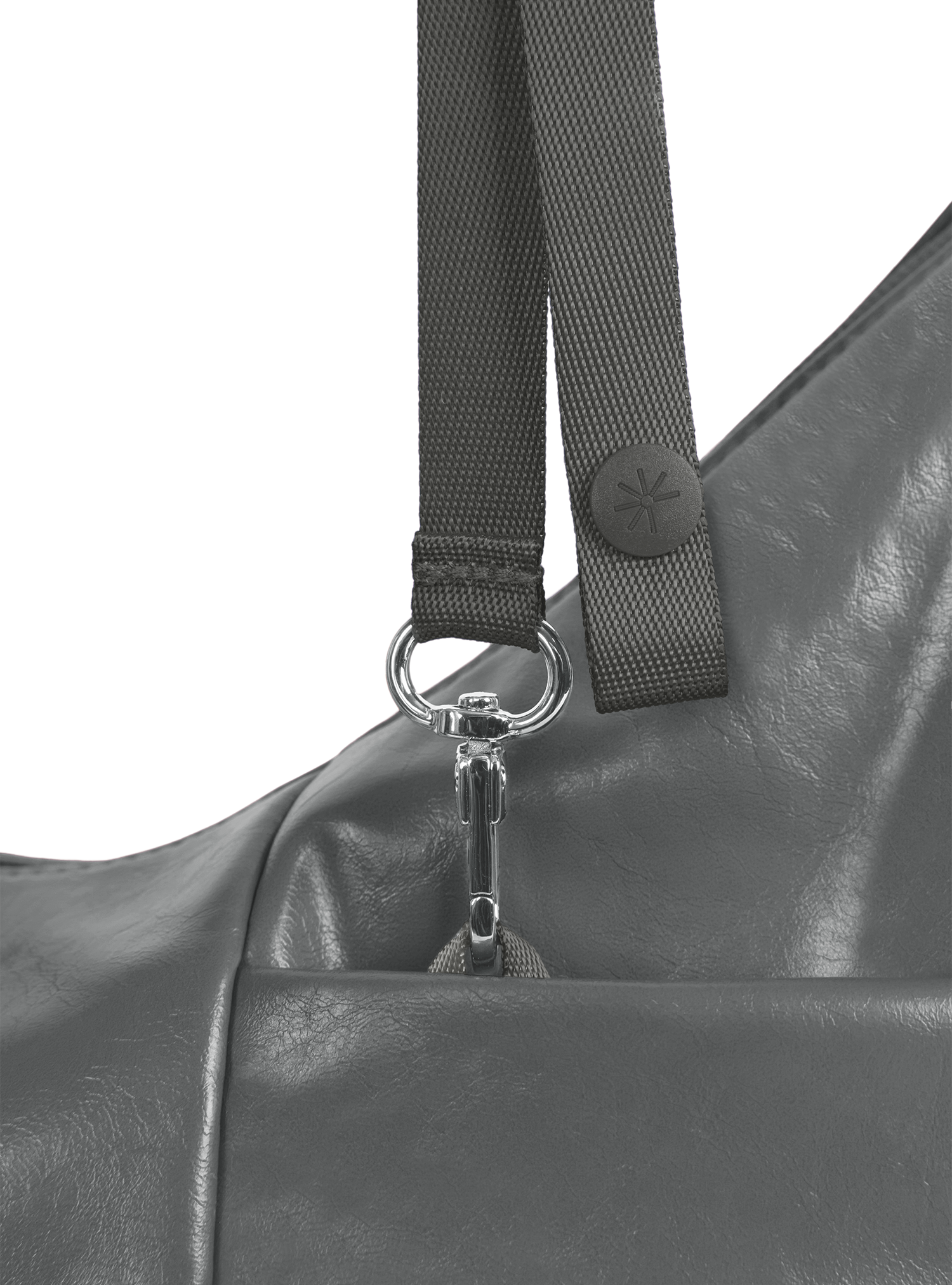 Exterior pocket of the Mini Arc hobo-style shoulder bag in deep grey vegan leather, with concealed snap loop