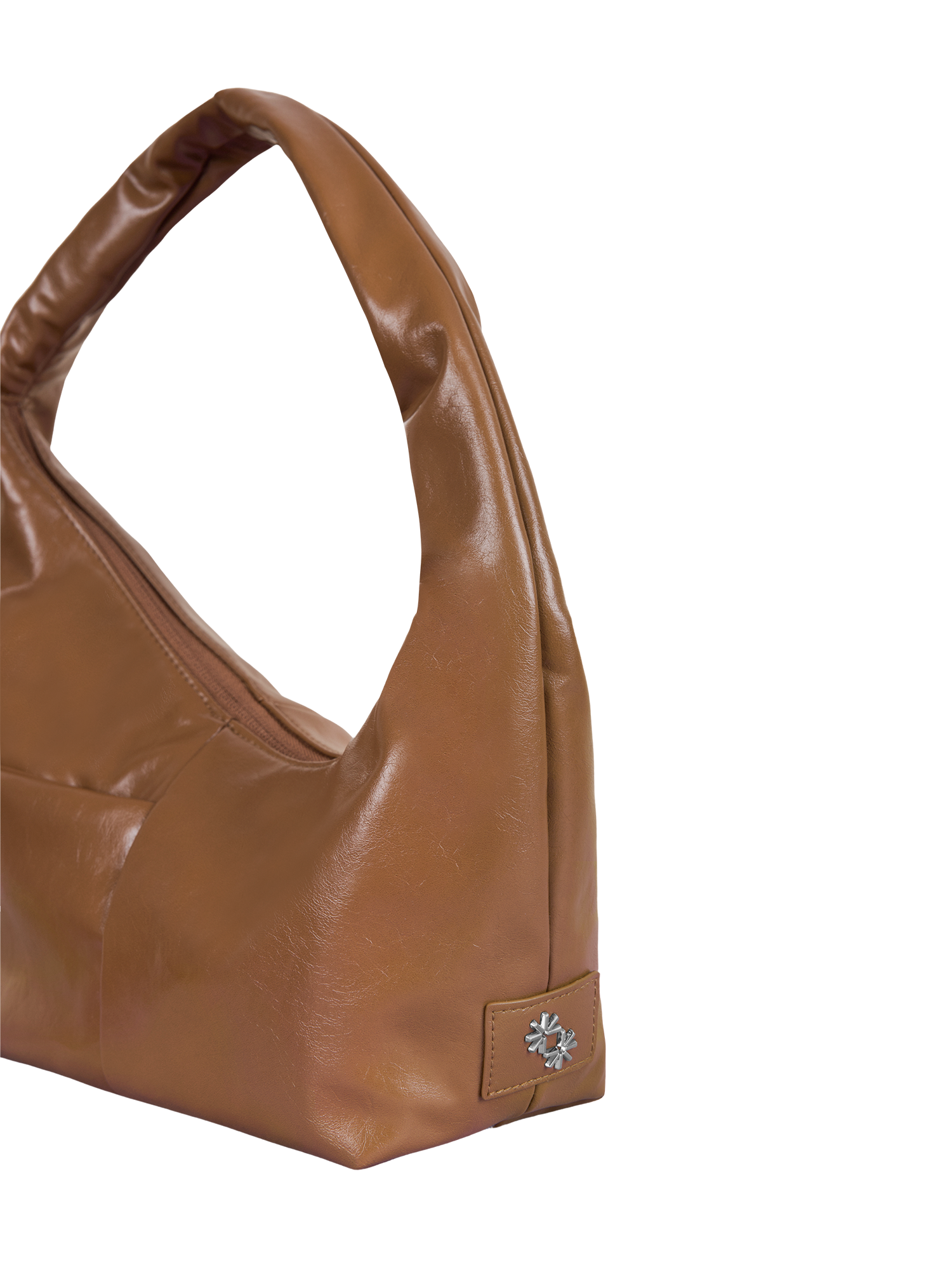 Close-up of the Mini Arc hobo-style shoulder bag in warm brown vegan leather, showing metal logo emblem