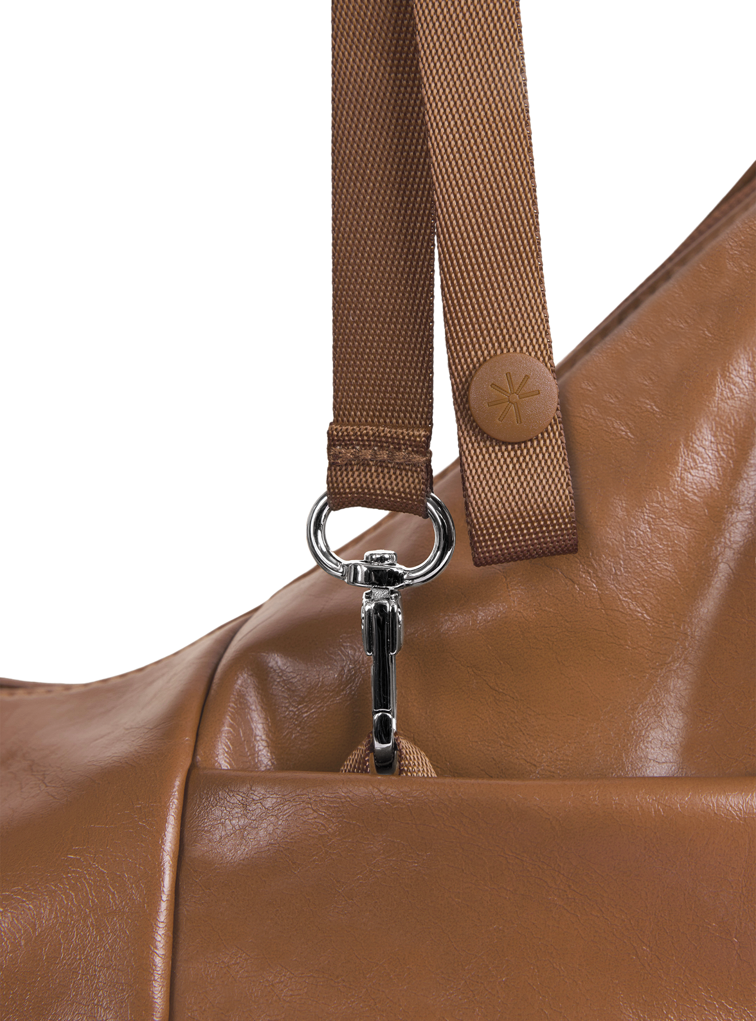 Exterior pocket of the Mini Arc hobo-style shoulder bag in warm brown vegan leather, with concealed snap loop