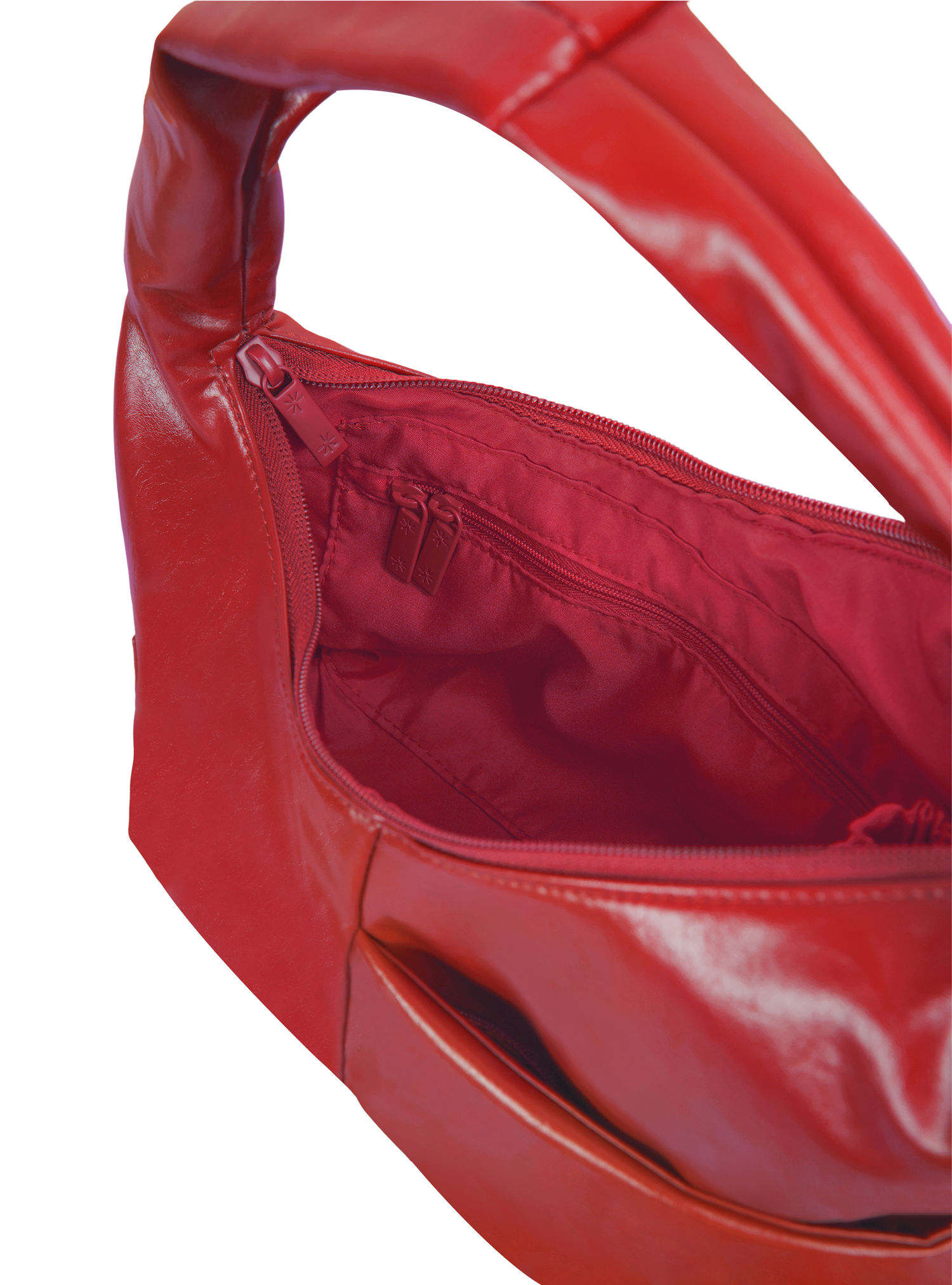 Interior of the Mini Arc hobo-style shoulder bag in red vegan leather, with zipped interior pocket