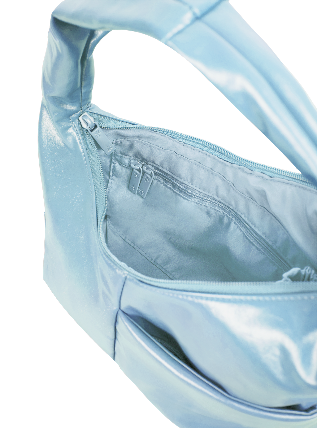Interior of the Mini Arc hobo-style shoulder bag in pale blue vegan leather, with zipped interior pocket