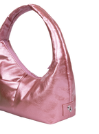 Close-up of the Mini Arc hobo-style shoulder bag in metallic pink vegan leather, showing metal logo emblem