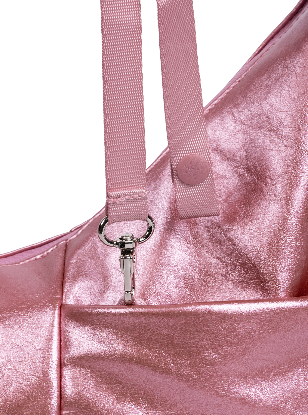 Exterior pocket of the Mini Arc hobo-style shoulder bag in metallic pink vegan leather, with concealed snap loop