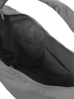 Interior of the Arc hobo-style bag in grey nylon, with multiple pockets and a bottle holder
