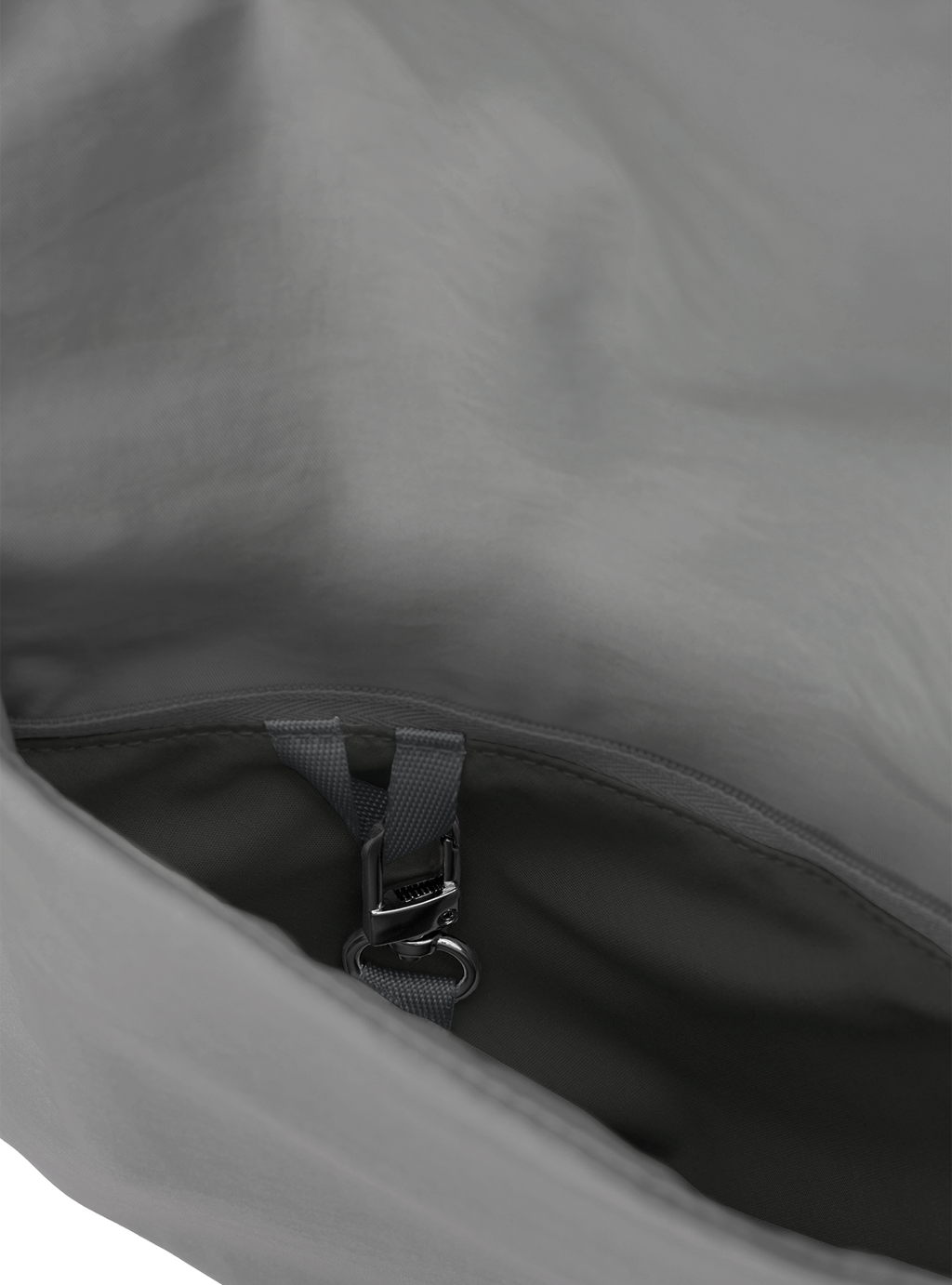 Exterior pocket of the Arc hobo-style bag in grey nylon, with concealed snap loop