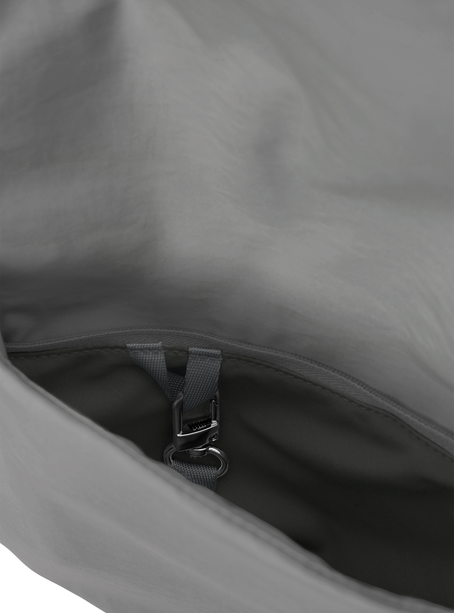 Exterior pocket of the Arc hobo-style bag in grey nylon, with concealed snap loop