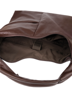 Interior of the Arc hobo-style bag in dark reddish brown matte vegan leather, with laptop compartment