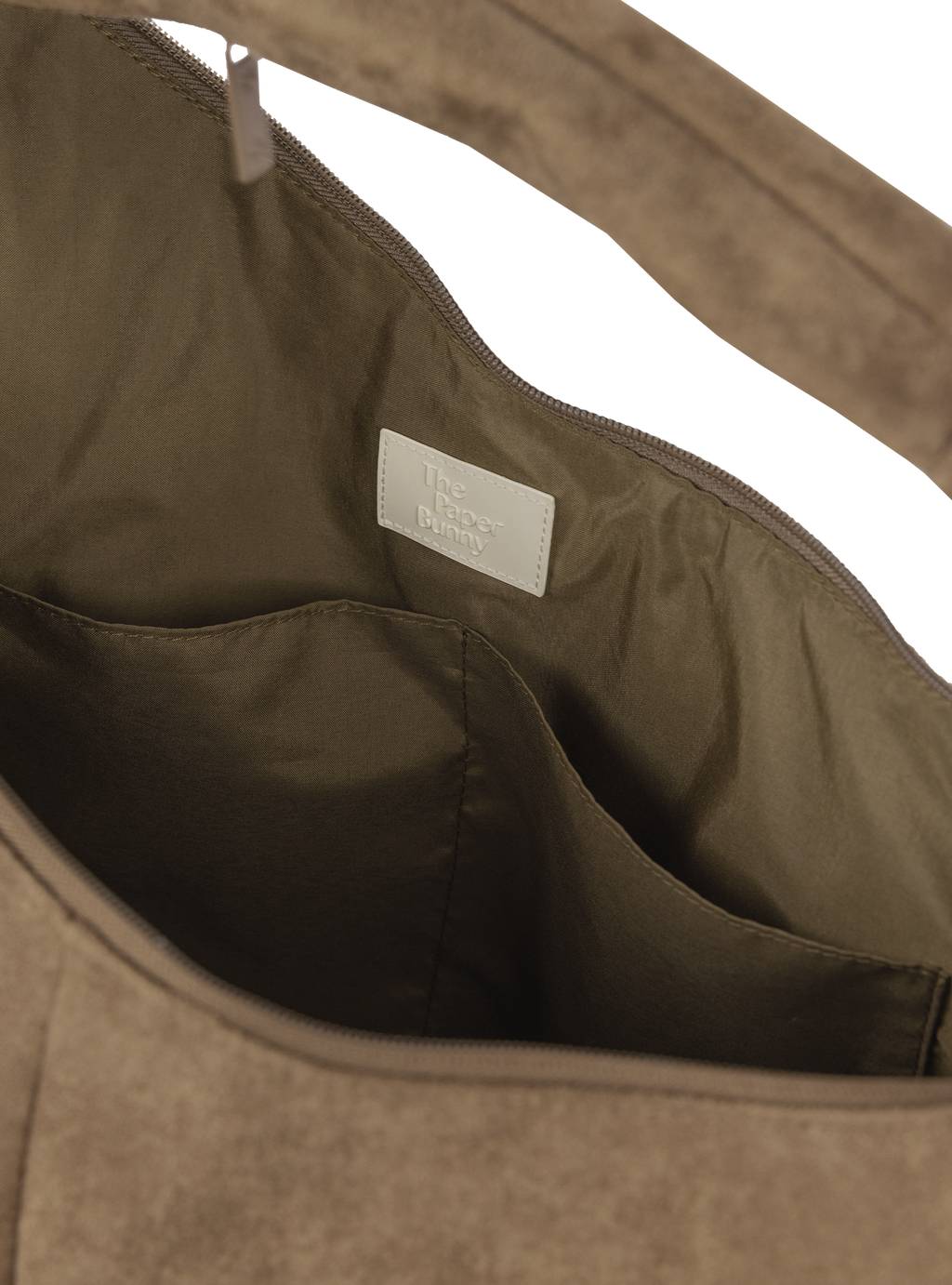 Interior of the Arc hobo-style bag in grey-beige suede, with multiple pockets