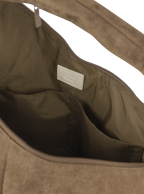 Interior of the Arc hobo-style bag in grey-beige suede, with multiple pockets