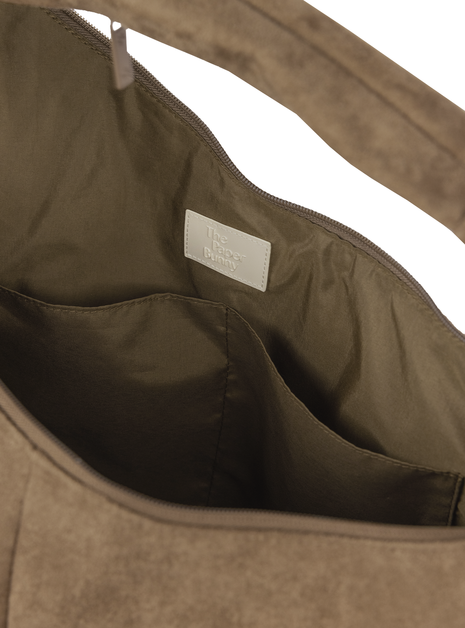 Interior of the Arc hobo-style bag in grey-beige suede, with multiple pockets